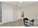 Spacious bedroom with glass-top desk and view into living area at 7095 17Th N Way, St Petersburg, FL 33702