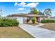 Cute ranch home with a large yard and a detached garage at 7095 17Th N Way, St Petersburg, FL 33702