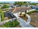 Tan single story house with attached garage and fenced yard at 7095 17Th N Way, St Petersburg, FL 33702