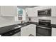Updated kitchen featuring white cabinets, granite countertops, and stainless steel appliances at 7095 17Th N Way, St Petersburg, FL 33702