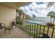 Balcony view of waterfront pool and bay at 7520 Sunshine Skyway S Ln # T18, St Petersburg, FL 33711