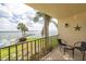 Balcony with waterfront views, and seating for two at 7520 Sunshine Skyway S Ln # T18, St Petersburg, FL 33711