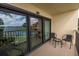 Balcony with sliding doors and water views at 7520 Sunshine Skyway S Ln # T18, St Petersburg, FL 33711