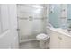 Updated bathroom with a walk-in shower and white vanity at 7520 Sunshine Skyway S Ln # T18, St Petersburg, FL 33711