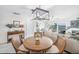 Bright dining room with round table at 7520 Sunshine Skyway S Ln # T18, St Petersburg, FL 33711