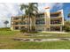 Building exterior with balconies and lush landscaping at 7520 Sunshine Skyway S Ln # T18, St Petersburg, FL 33711