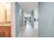 Long hallway offering a view of the living room and waterfront at 7520 Sunshine Skyway S Ln # T18, St Petersburg, FL 33711
