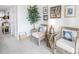 Bright hallway with wicker chairs and coastal decor at 7520 Sunshine Skyway S Ln # T18, St Petersburg, FL 33711