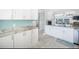 Updated kitchen with white shaker cabinets and granite counters at 7520 Sunshine Skyway S Ln # T18, St Petersburg, FL 33711