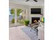 Living room with fireplace and water view at 7520 Sunshine Skyway S Ln # T18, St Petersburg, FL 33711