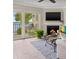 Living room with fireplace and water view at 7520 Sunshine Skyway S Ln # T18, St Petersburg, FL 33711