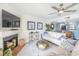 Living room with fireplace and sofas at 7520 Sunshine Skyway S Ln # T18, St Petersburg, FL 33711