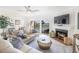 Living room with fireplace and water view at 7520 Sunshine Skyway S Ln # T18, St Petersburg, FL 33711