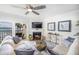 Living room with fireplace and water view at 7520 Sunshine Skyway S Ln # T18, St Petersburg, FL 33711
