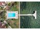 Overhead view of community pool and private pier at 7520 Sunshine Skyway S Ln # T18, St Petersburg, FL 33711