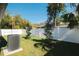 Neat backyard with new landscaping and a white privacy fence at 7909 N 12Th St, Tampa, FL 33604