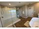 Modern bathroom with large walk-in shower and soaking tub at 8365 Capstone Ranch Dr, New Port Richey, FL 34655