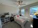 Bright bedroom with a queen bed and ample natural light at 8365 Capstone Ranch Dr, New Port Richey, FL 34655