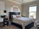 Cozy bedroom with a queen-size bed and a window seat at 8365 Capstone Ranch Dr, New Port Richey, FL 34655