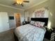 Well-lit bedroom with a queen bed and en-suite bathroom access at 8365 Capstone Ranch Dr, New Port Richey, FL 34655