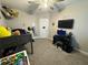 Youth bedroom with a gaming setup and built-in shelving at 8365 Capstone Ranch Dr, New Port Richey, FL 34655