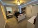 Spacious bedroom with a queen bed, desk and large closet at 8365 Capstone Ranch Dr, New Port Richey, FL 34655