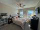 Bright bedroom with a queen bed and ample natural light at 8365 Capstone Ranch Dr, New Port Richey, FL 34655