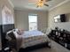Comfortable bedroom with a queen-size bed and built-in shelving at 8365 Capstone Ranch Dr, New Port Richey, FL 34655