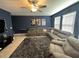 Spacious bonus room with sectional sofa and entertainment area at 8365 Capstone Ranch Dr, New Port Richey, FL 34655