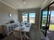Dining room with water view and access to backyard at 8365 Capstone Ranch Dr, New Port Richey, FL 34655