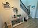 Entryway with console table, decor, and view of staircase at 8365 Capstone Ranch Dr, New Port Richey, FL 34655