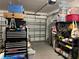 Organized garage with storage shelving and overhead storage at 8365 Capstone Ranch Dr, New Port Richey, FL 34655