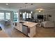 Modern kitchen with a large island, stainless steel appliances, and open layout at 8365 Capstone Ranch Dr, New Port Richey, FL 34655