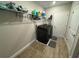 Laundry room with washer, dryer, and shelving at 8365 Capstone Ranch Dr, New Port Richey, FL 34655