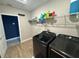 Laundry room with washer, dryer, and shelving at 8365 Capstone Ranch Dr, New Port Richey, FL 34655