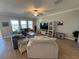 Spacious living area featuring comfortable seating, a large TV, and plenty of natural light at 8365 Capstone Ranch Dr, New Port Richey, FL 34655