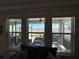 Scenic view of lake and backyard from living room window at 8365 Capstone Ranch Dr, New Port Richey, FL 34655