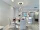 Bright dining area with glass table and modern chairs at 8651 10Th N St # 128, St Petersburg, FL 33702