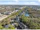 Aerial view of community near lake and conservation at 9626 Charlesberg Dr, Tampa, FL 33635
