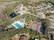 Community pool, tennis courts, playground, and surrounding homes at 9626 Charlesberg Dr, Tampa, FL 33635
