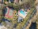 Community pool, tennis courts, playground, and parking area at 9626 Charlesberg Dr, Tampa, FL 33635