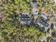 Aerial view of community, including buildings, parking lot and lush landscaping at 9626 Charlesberg Dr, Tampa, FL 33635