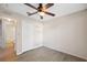Spacious bedroom with ceiling fan and wood-look floors at 9626 Charlesberg Dr, Tampa, FL 33635