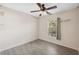 Bright bedroom with a ceiling fan and wood-look floors at 9626 Charlesberg Dr, Tampa, FL 33635