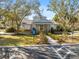 Community clubhouse with landscaping and parking at 9626 Charlesberg Dr, Tampa, FL 33635