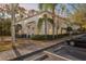 Two-story townhome with light-colored siding, landscaping, and a paved walkway at 9626 Charlesberg Dr, Tampa, FL 33635