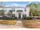 Front view of two-story townhome, showcasing its entrance and landscaping at 9626 Charlesberg Dr, Tampa, FL 33635