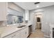 Modern kitchen with white cabinets, stainless steel appliances and view to living room at 9626 Charlesberg Dr, Tampa, FL 33635