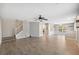 Spacious living room features gray walls, wood-look tile floors, and a ceiling fan at 9626 Charlesberg Dr, Tampa, FL 33635