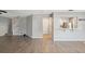 Open floor plan with a view of the kitchen and staircase from the living area at 9626 Charlesberg Dr, Tampa, FL 33635
